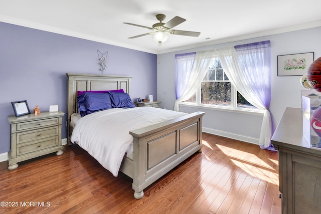 bedroom featuring ornamental molding, wood-type flooring, and baseboards