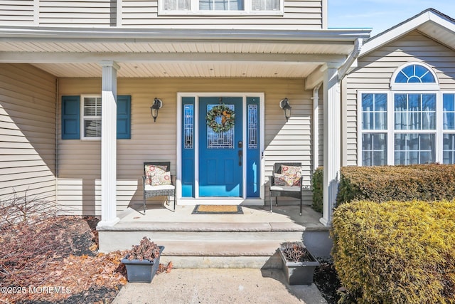 doorway to property featuring covered porch