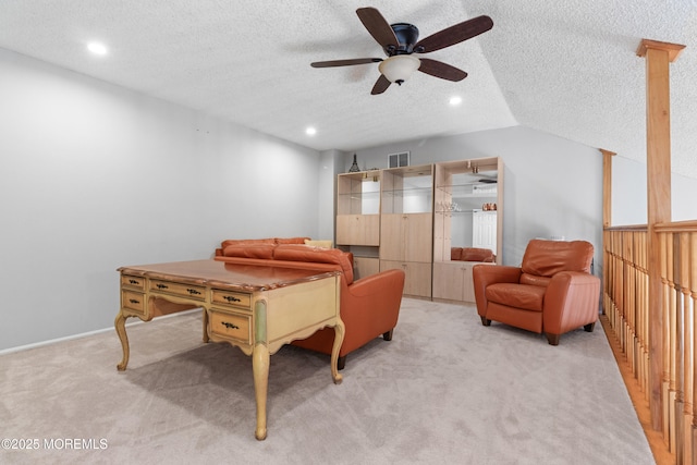 living area featuring recessed lighting, visible vents, light carpet, vaulted ceiling, and a textured ceiling