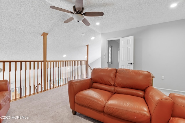 carpeted living room featuring a textured ceiling, ceiling fan, and recessed lighting