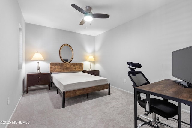 bedroom with ceiling fan, baseboards, and light colored carpet