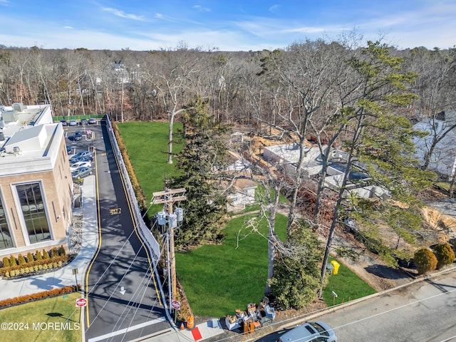 aerial view featuring a wooded view