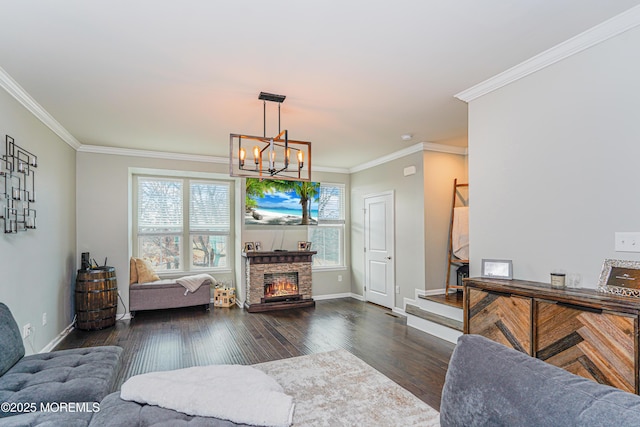 living room featuring baseboards, a stone fireplace, dark wood-type flooring, and crown molding