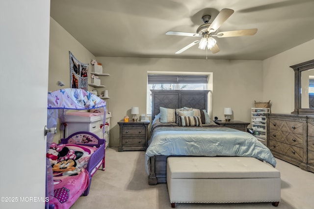 carpeted bedroom with a ceiling fan