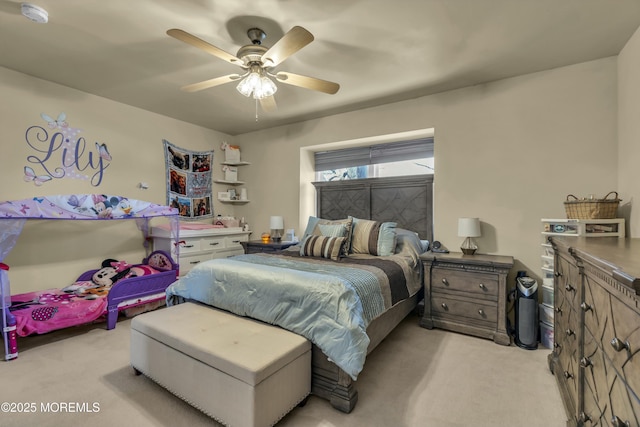 bedroom with light colored carpet and a ceiling fan