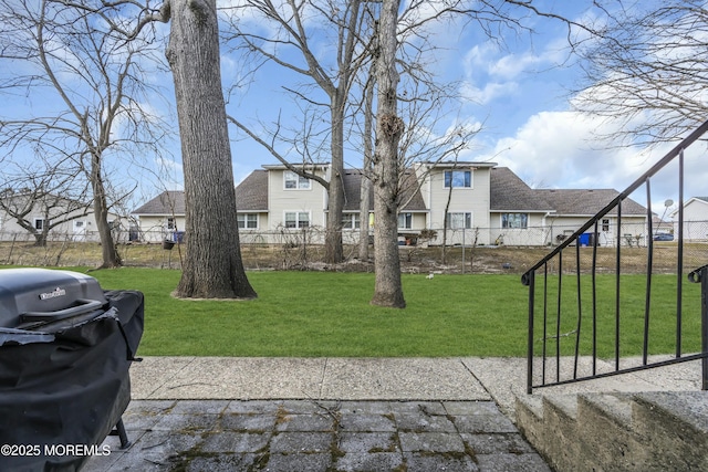 view of yard with a residential view and fence