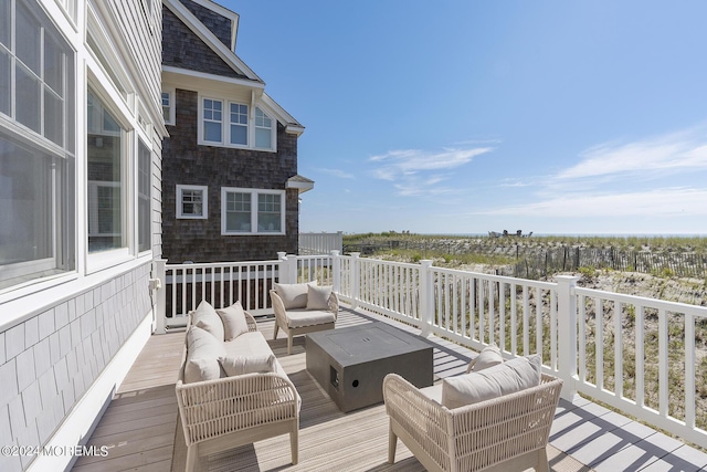 wooden terrace featuring an outdoor hangout area