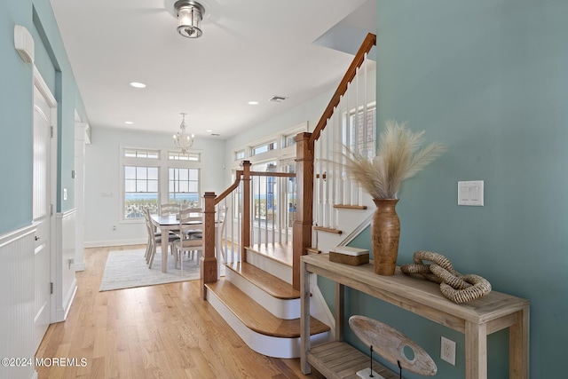 interior space featuring recessed lighting, visible vents, stairway, a chandelier, and light wood-type flooring