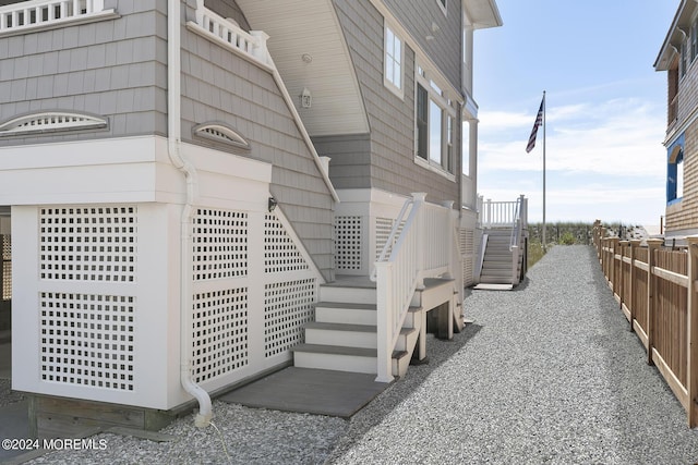 view of home's exterior with fence