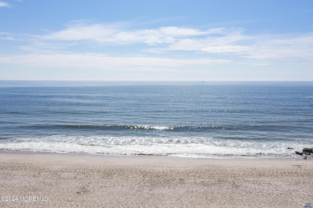 view of water feature with a beach view