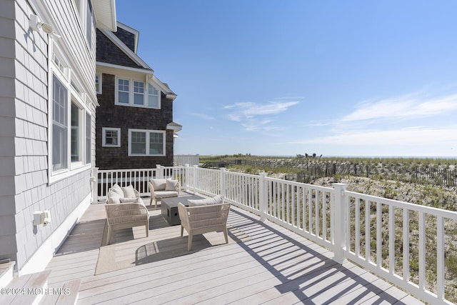 wooden deck with an outdoor living space