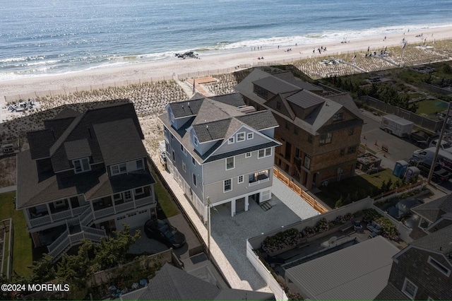 aerial view featuring a water view and a view of the beach