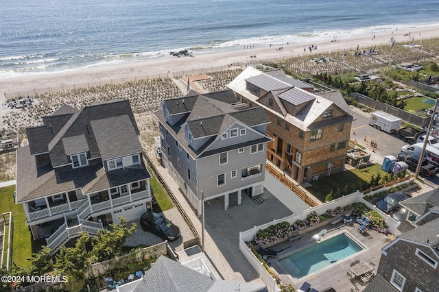 bird's eye view with a water view and a view of the beach