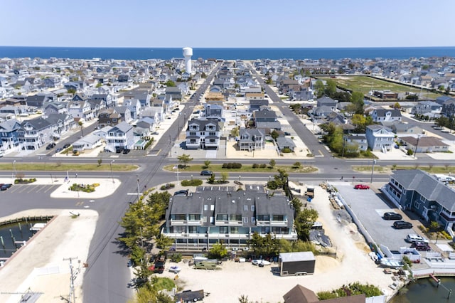 bird's eye view with a residential view and a water view