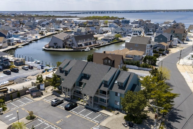 aerial view featuring a residential view and a water view