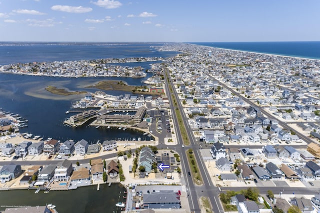 bird's eye view with a residential view and a water view