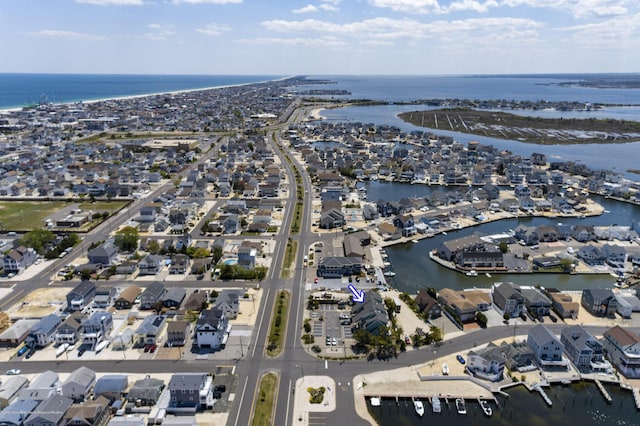 drone / aerial view with a residential view and a water view