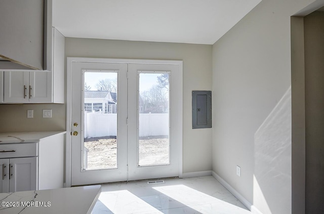 doorway to outside featuring marble finish floor, french doors, visible vents, electric panel, and baseboards