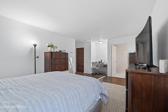 bedroom with wood finished floors