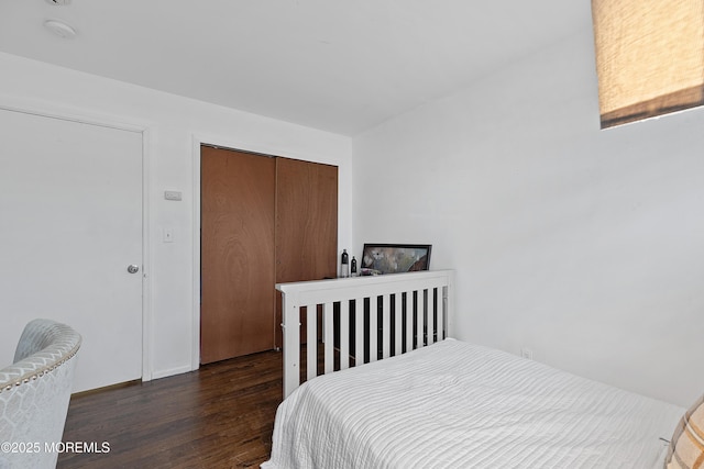 bedroom featuring a closet and wood finished floors