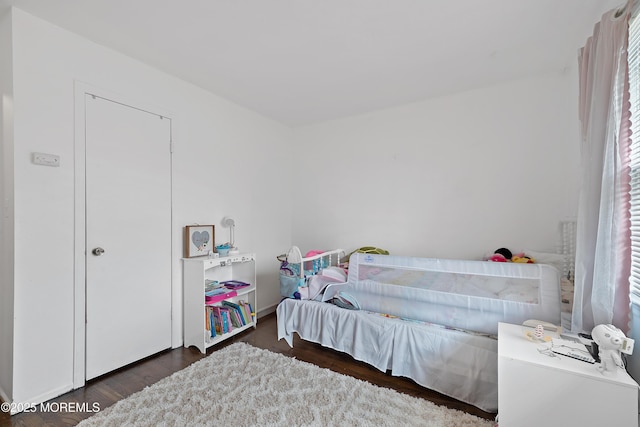 bedroom with wood finished floors