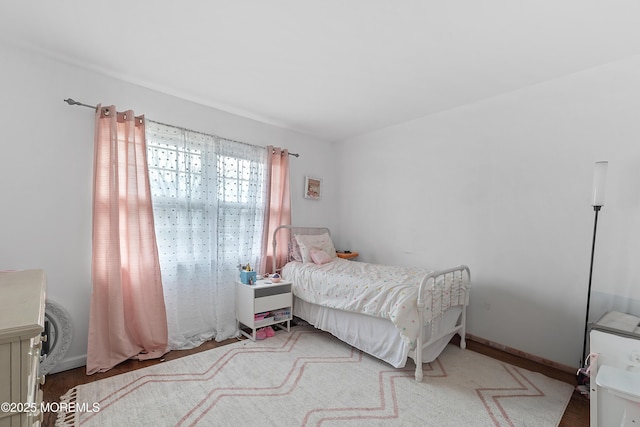 bedroom featuring baseboards