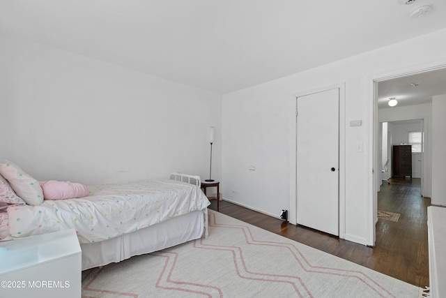 bedroom featuring wood finished floors