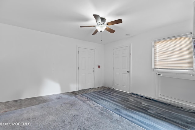 unfurnished room featuring a ceiling fan and wood finished floors