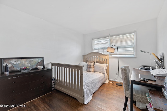 bedroom featuring wood finished floors