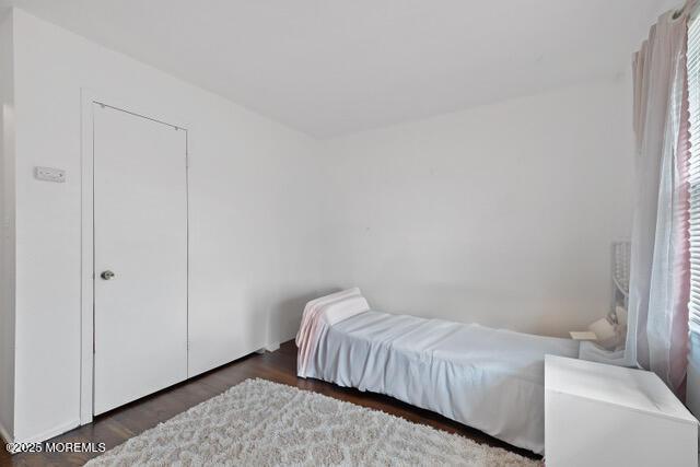 bedroom with wood finished floors