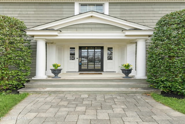 property entrance featuring a porch