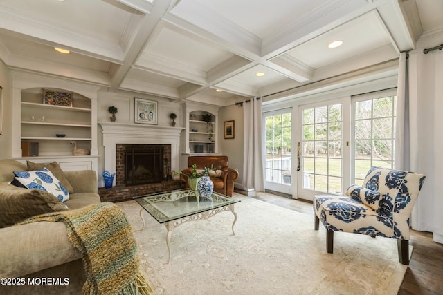 living room featuring beam ceiling, crown molding, and coffered ceiling