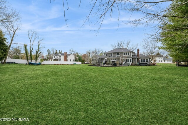 view of yard with fence