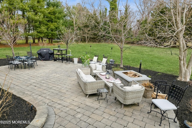 view of patio with a fire pit and area for grilling