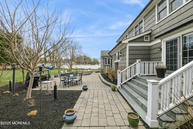 view of patio featuring outdoor dining area