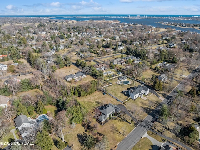 bird's eye view featuring a residential view and a water view