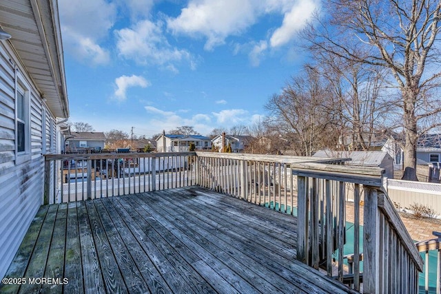 wooden terrace with a residential view