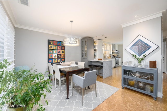 dining area with visible vents and ornamental molding