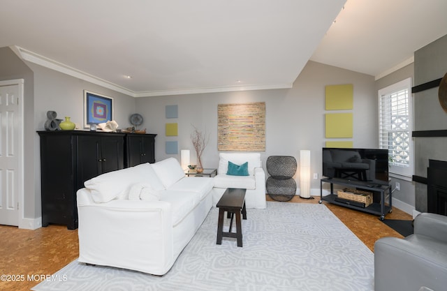 living area featuring lofted ceiling, crown molding, and baseboards