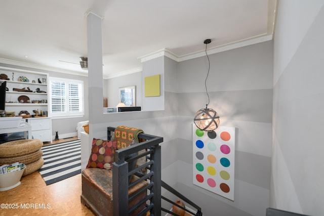 living area with ornamental molding