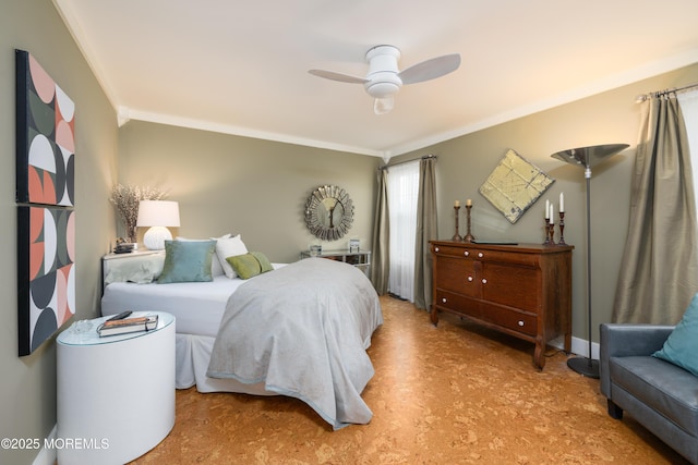 bedroom featuring a ceiling fan and ornamental molding