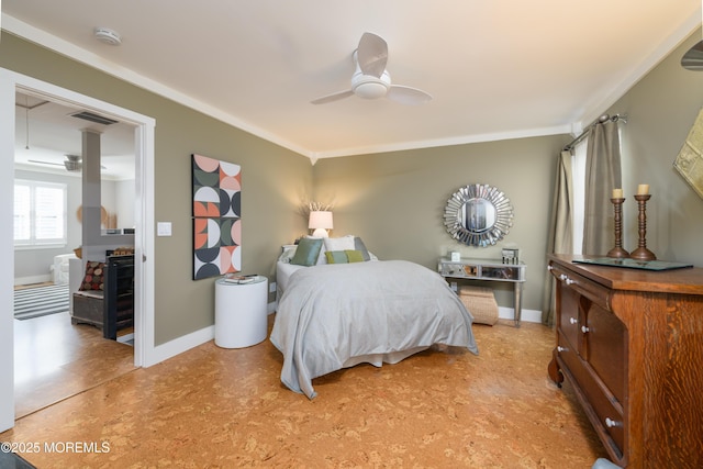 bedroom with visible vents, ceiling fan, crown molding, and baseboards