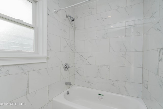 bathroom with shower / bathtub combination