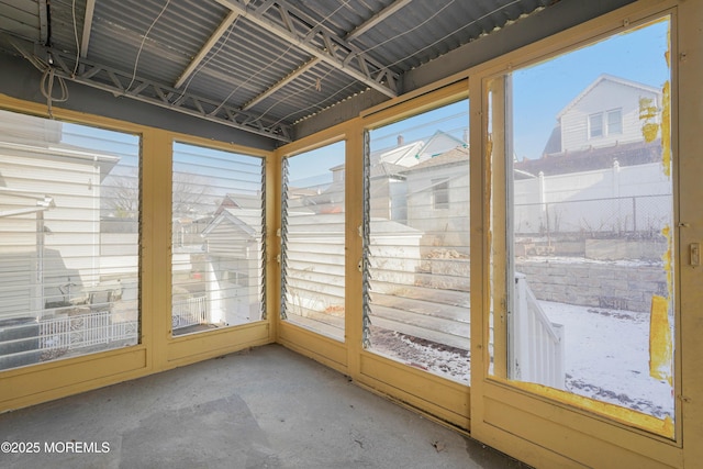 unfurnished sunroom featuring plenty of natural light