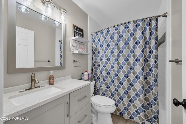 full bathroom with a shower with shower curtain, vanity, and toilet