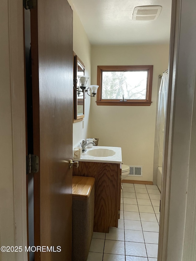 bathroom featuring toilet, tile patterned flooring, visible vents, and vanity