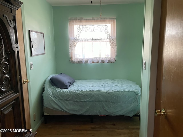 bedroom featuring wood finished floors