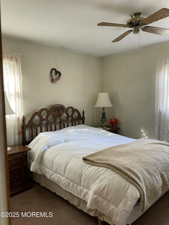 carpeted bedroom featuring a ceiling fan