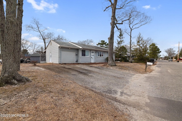 view of front of home featuring driveway and an attached garage