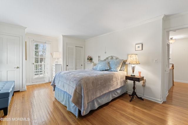 bedroom with baseboards, light wood-type flooring, access to exterior, and crown molding